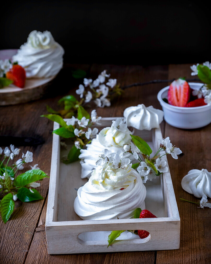 Pavlova dessert with cream and strawberries