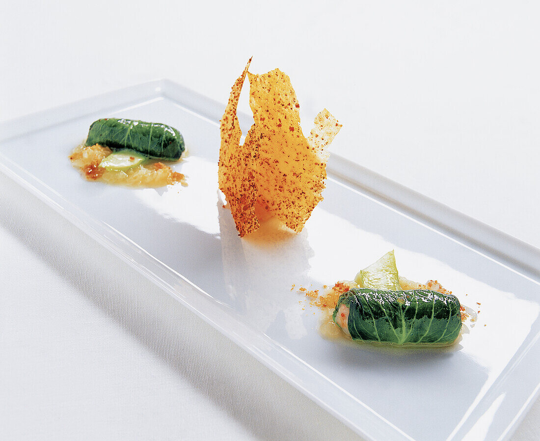 Mustard cabbage leaves stuffed with Norway lobster, white cabbage powder and crisps