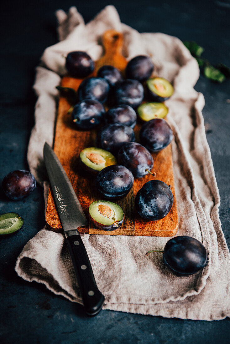 Plums on a Slicing Board