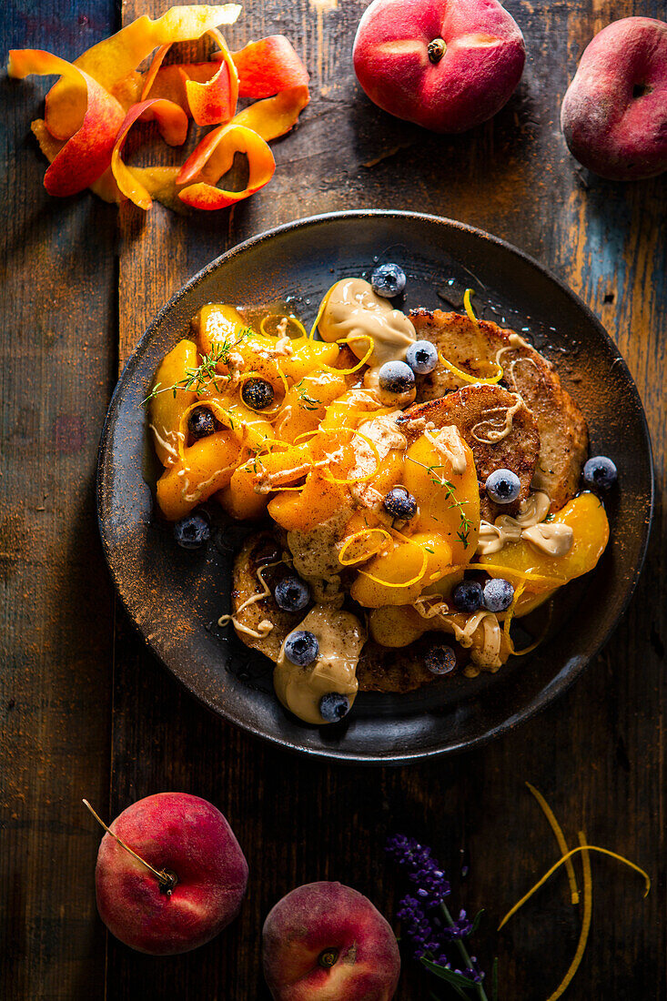 French toast with peaches, blueberries, and orange zest