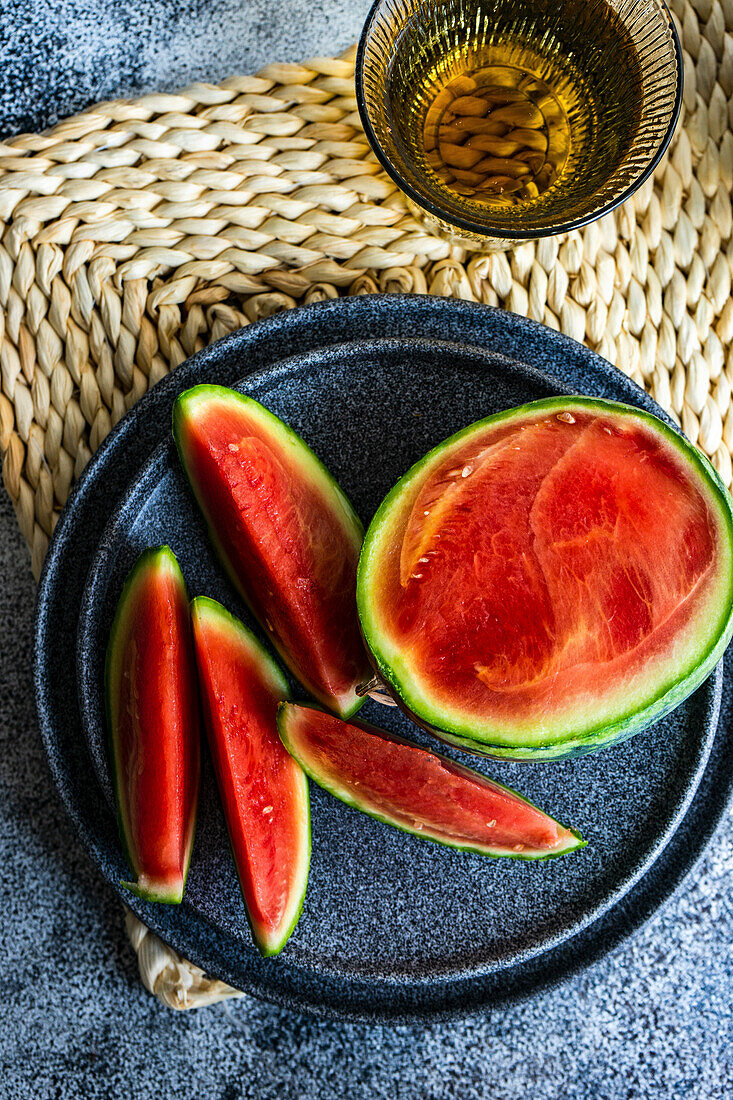 Tasty ripe watermelon on concrete background