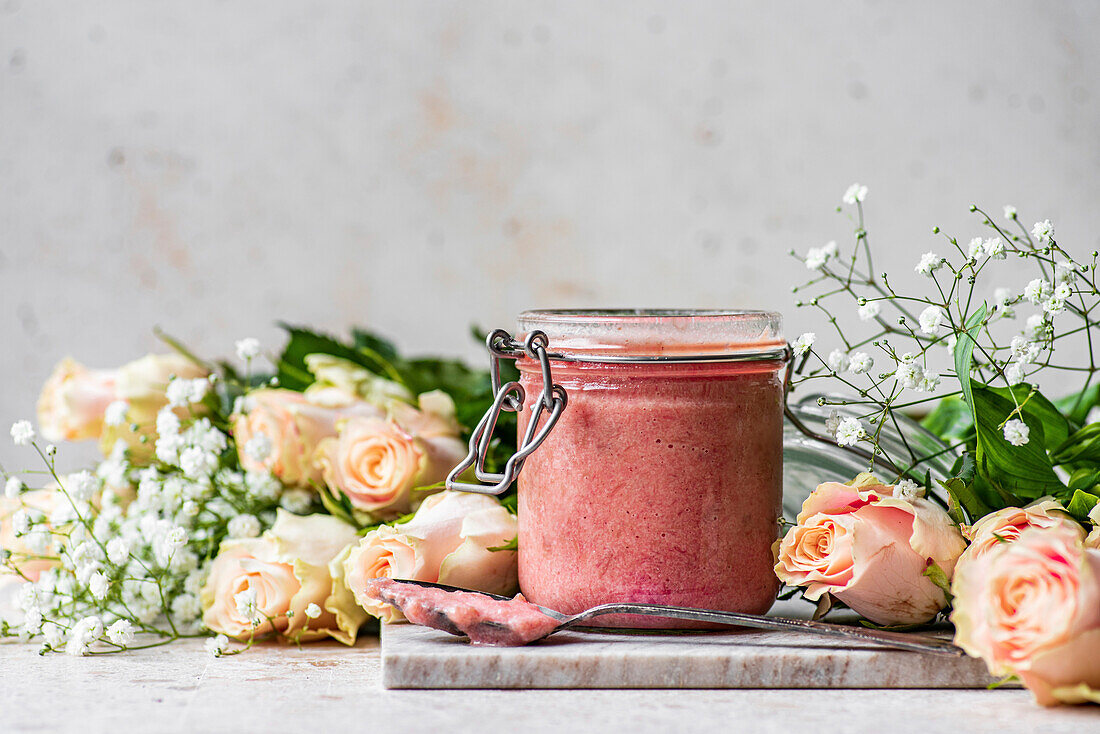 Rhubarb Curd in a jar with flowers
