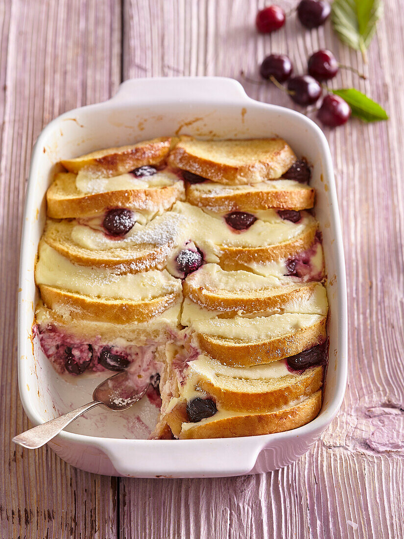 Bread pudding with custard and sour cherries