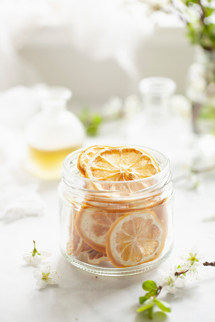 A jar of dehydrated lemon wheels suitable for cocktail or cake garnishes