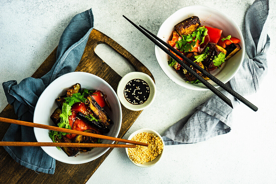 Fresh Asian style vegetable salad with fried eggplant and soy sauce