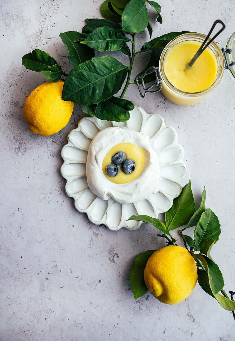 Lemon Curd spooned in meringue nests with blueberries