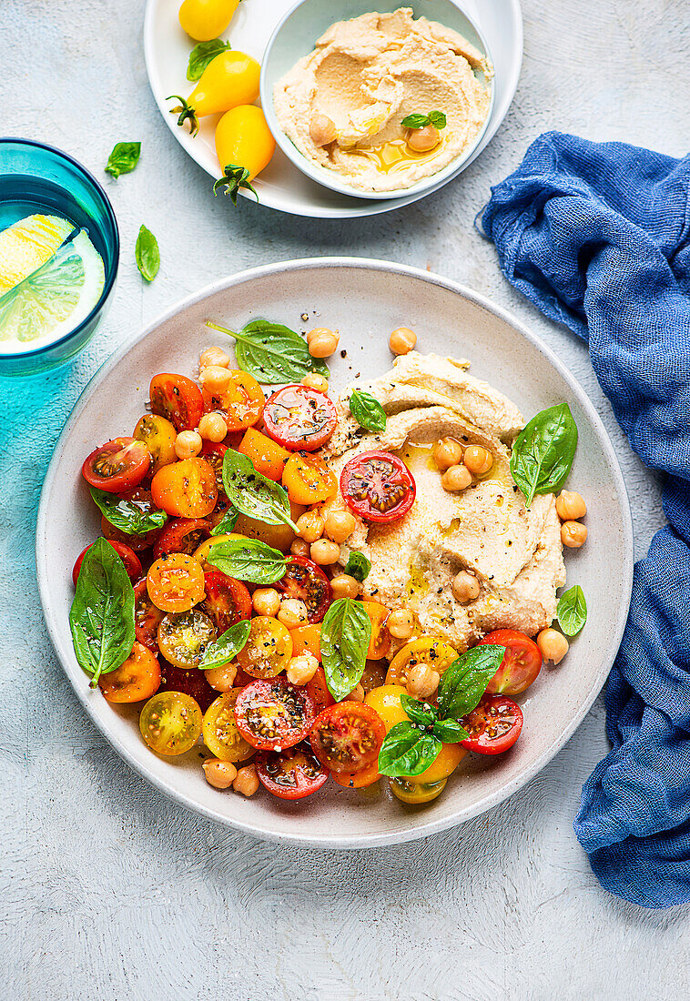 Hummus with a colourful tomato salad