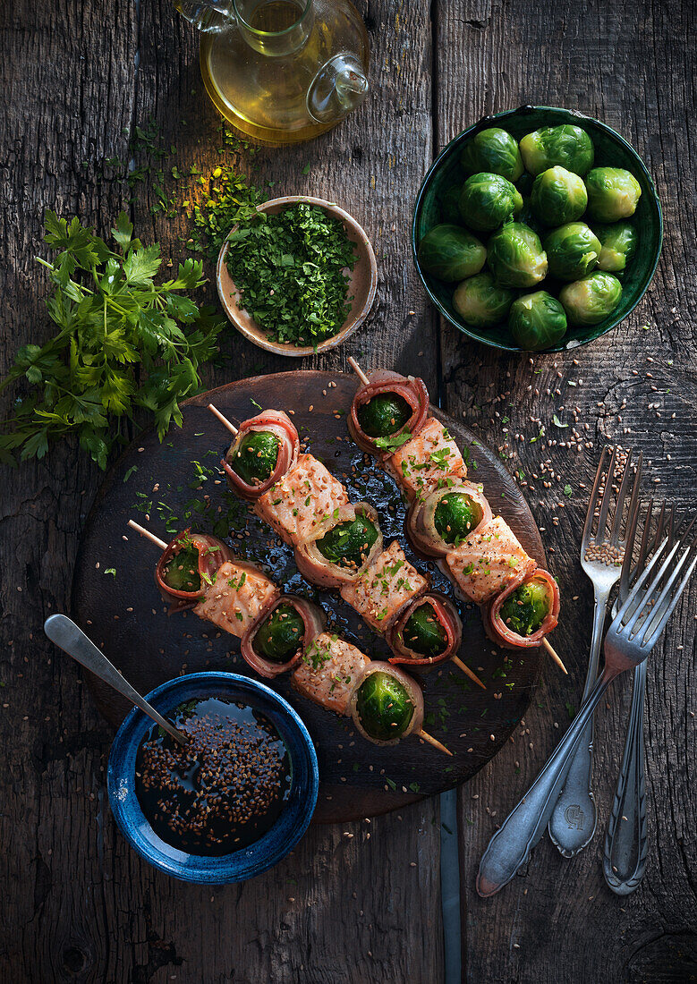 Grilled salmon skewers with bacon and Brussels sprouts