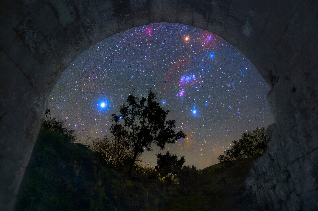 Night sky viewed from the entrance of a castle