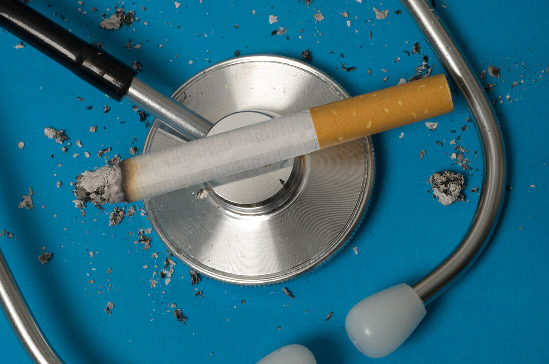 Lit cigarette on top of a stethoscope