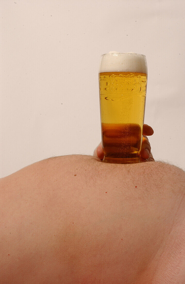 Man resting pint on his stomach