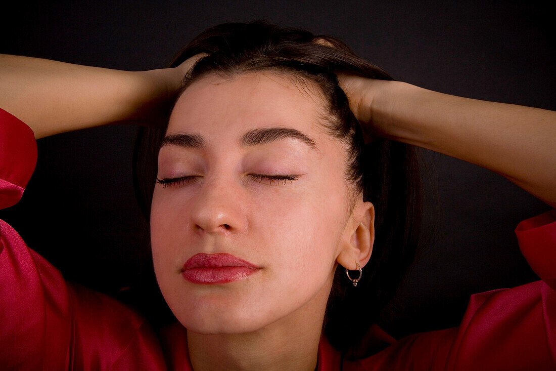 Woman running her hands through her hair