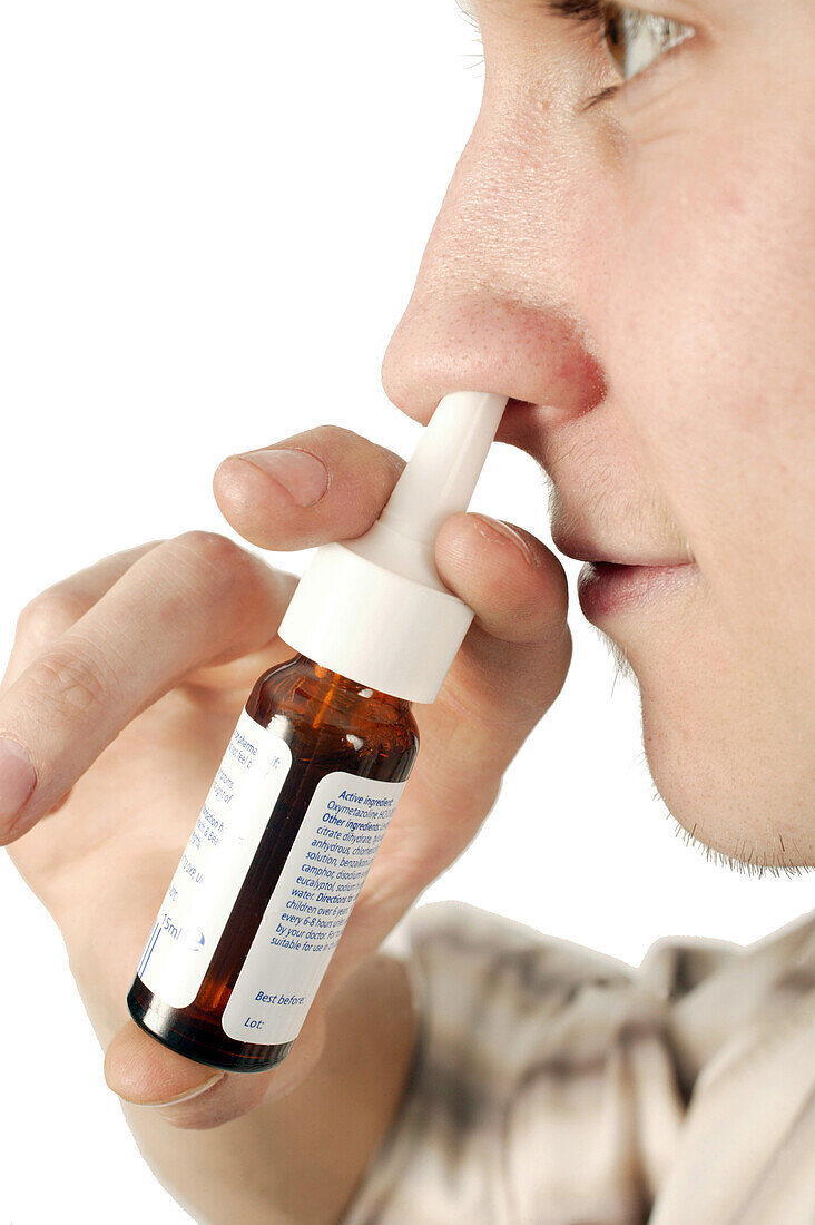 Man using a nasal spray