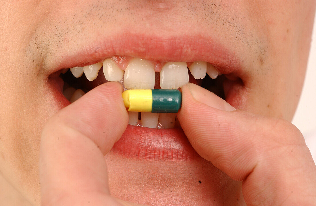 Person taking a pill