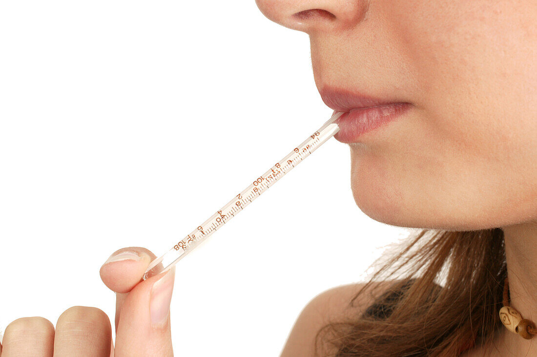 Woman with a thermometer in her mouth