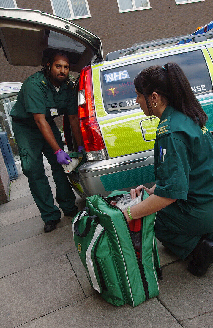 Emergency medical technicians check medical supplies