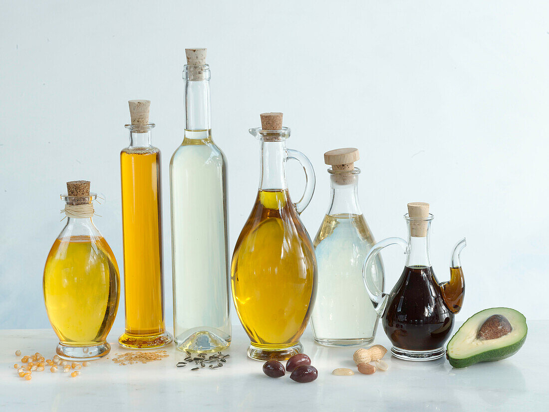 Various oils in bottles on a light background