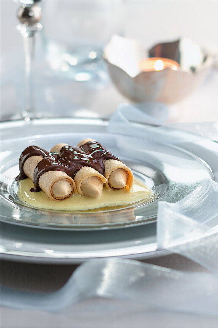 Nougat cannelloni with chocolate sauce