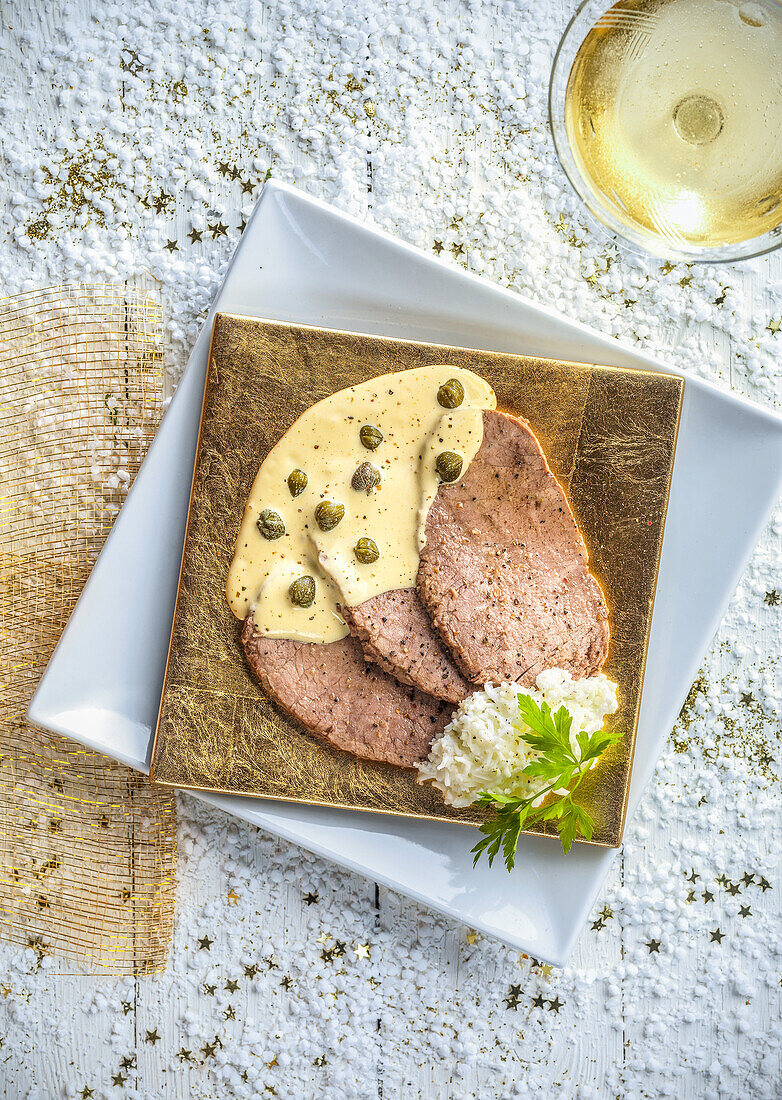 Vitello tonnato on a golden platter (Christmas)