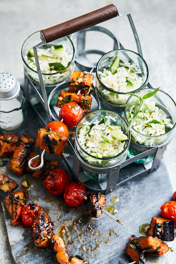 Chilli aubergine skewers with cucumber and rice salad