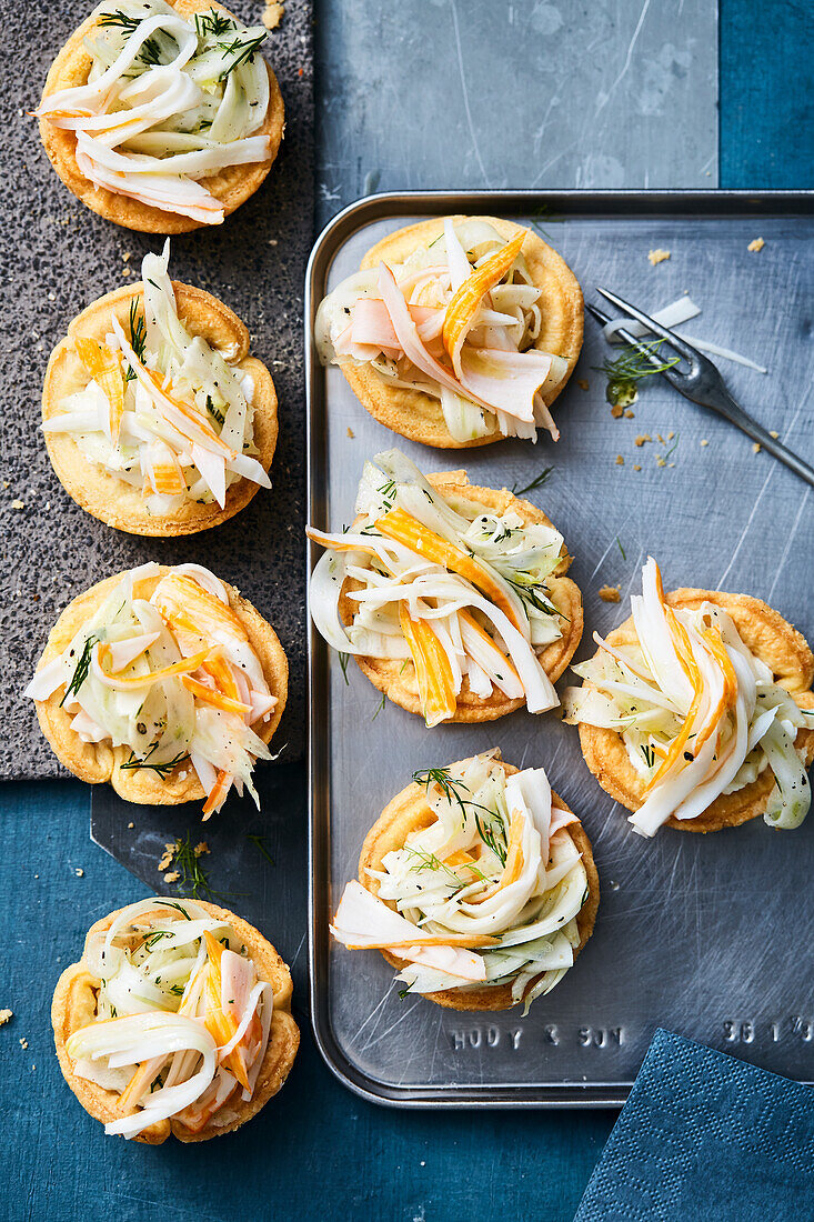 Filled tartlets with fennel surimi salad