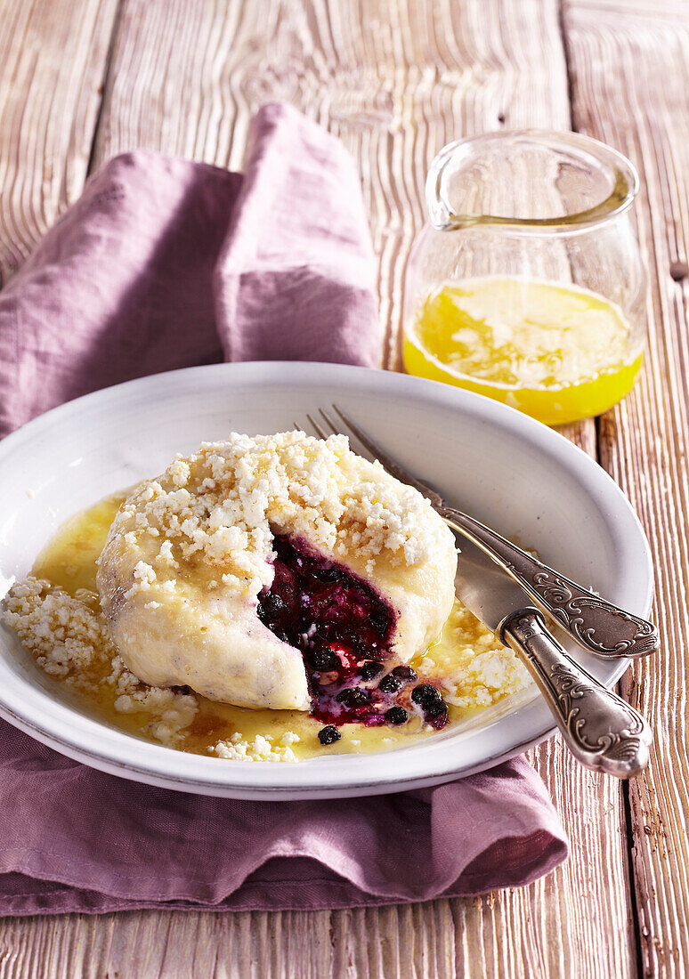 Breaded dumplings with blueberries