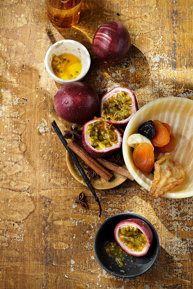 Still life with passion fruit, dried fruit and spices