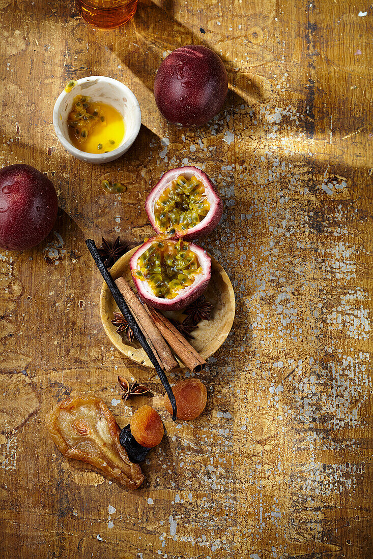 Still life with passion fruit, dried fruit and spices