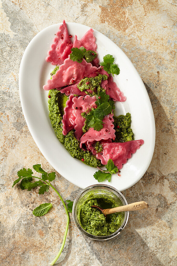 Beetroot ravioli with cheese filling and mint-coriander pesto