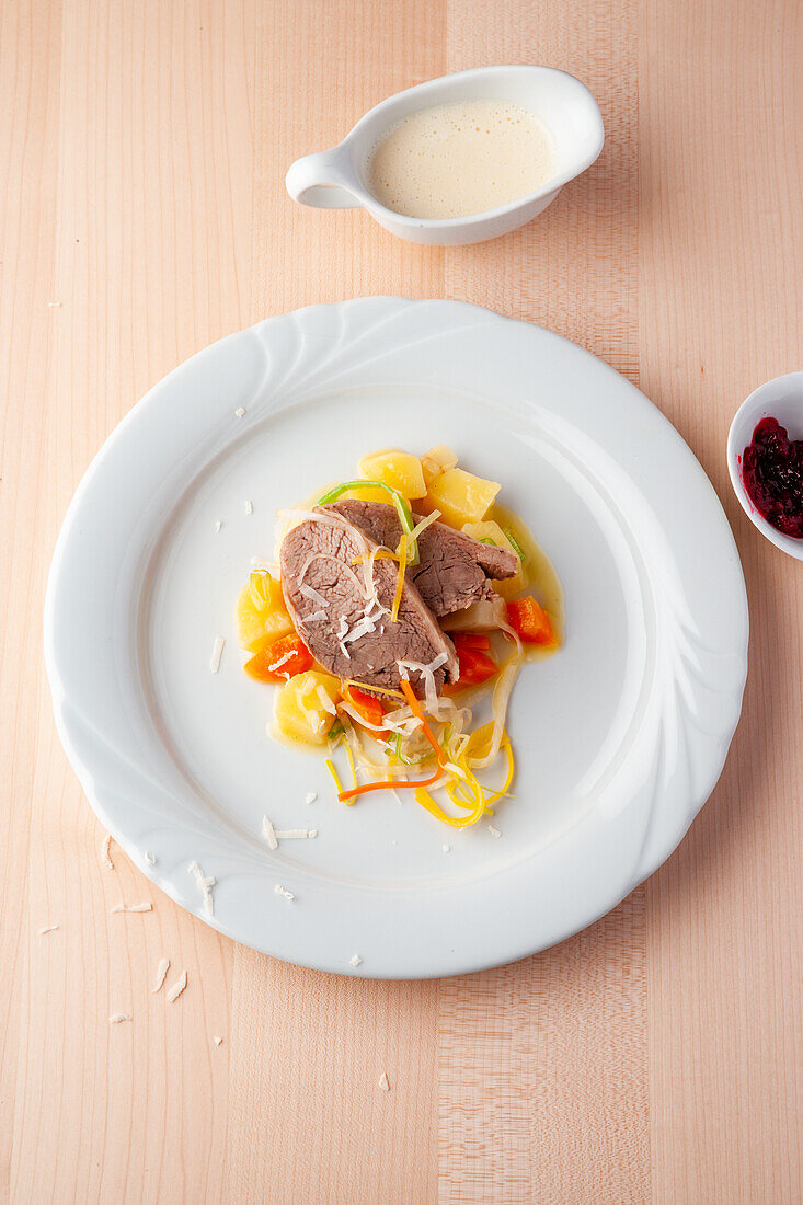 Baden veal shoulder with a root stock and bouillon potatoes