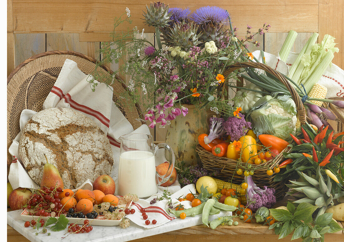 An arrangement of healthy food for vegetarians – fruit, vegetables, brioche