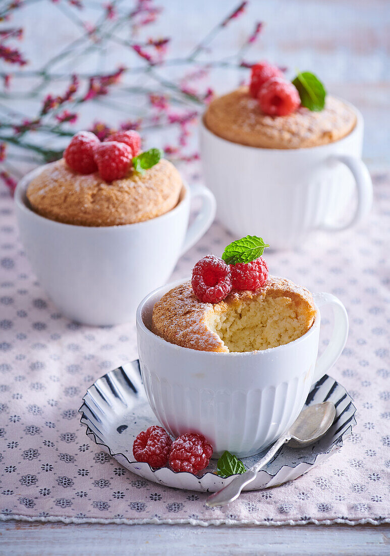 Vanilla soufflé in cup with raspberries