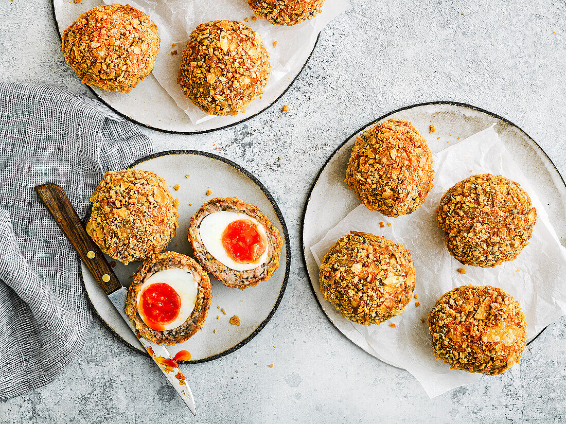 Scotch eggs, whole and sliced