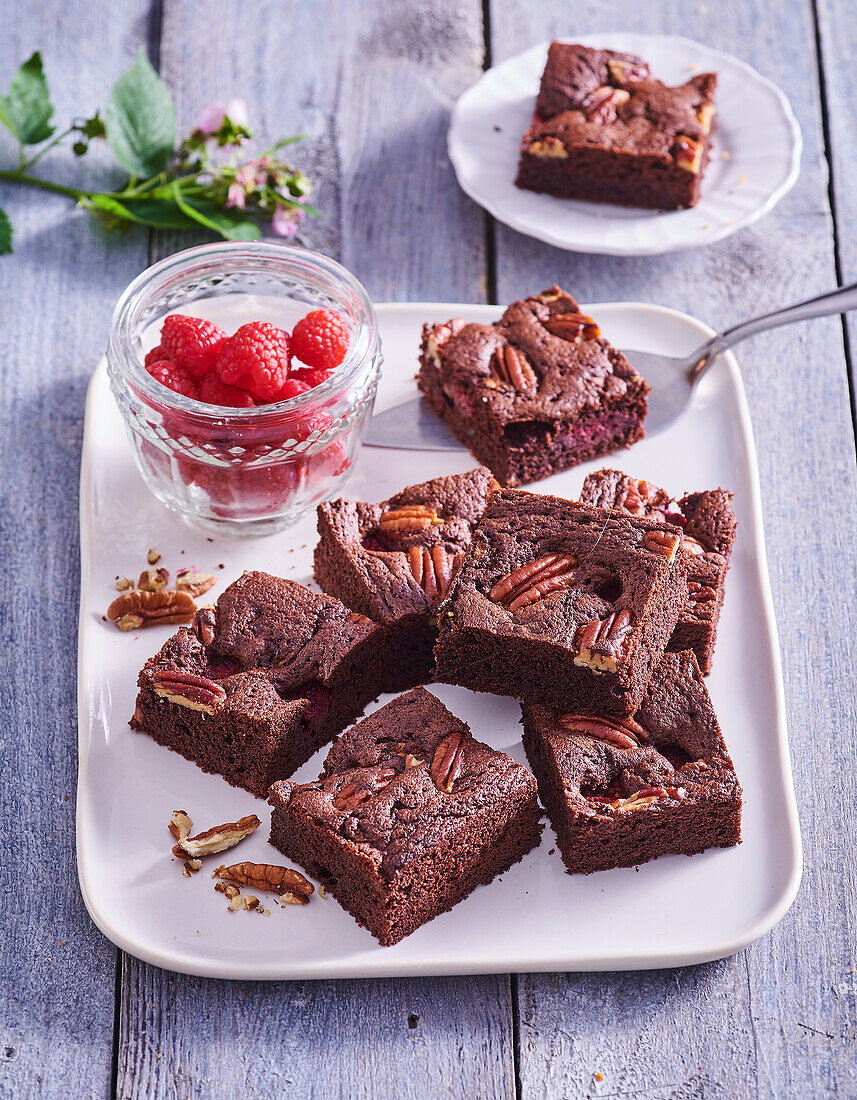 Zucchini brownies with raspberries and pecan nuts