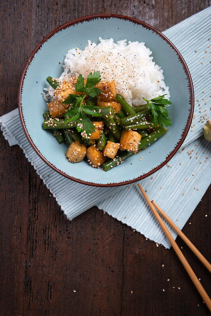 Marinated fried tofu with green beans and sesame seeds