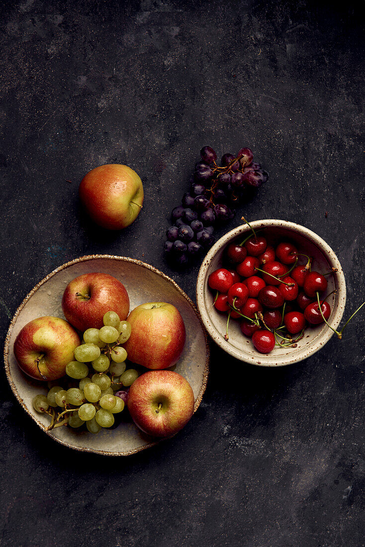 Still life with sweet cherries, Braeburn apples, and grapes