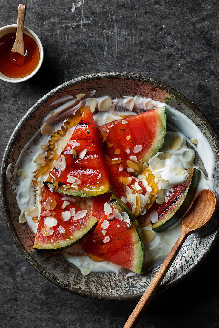Grilled watermelon with Greek yogurt and almonds
