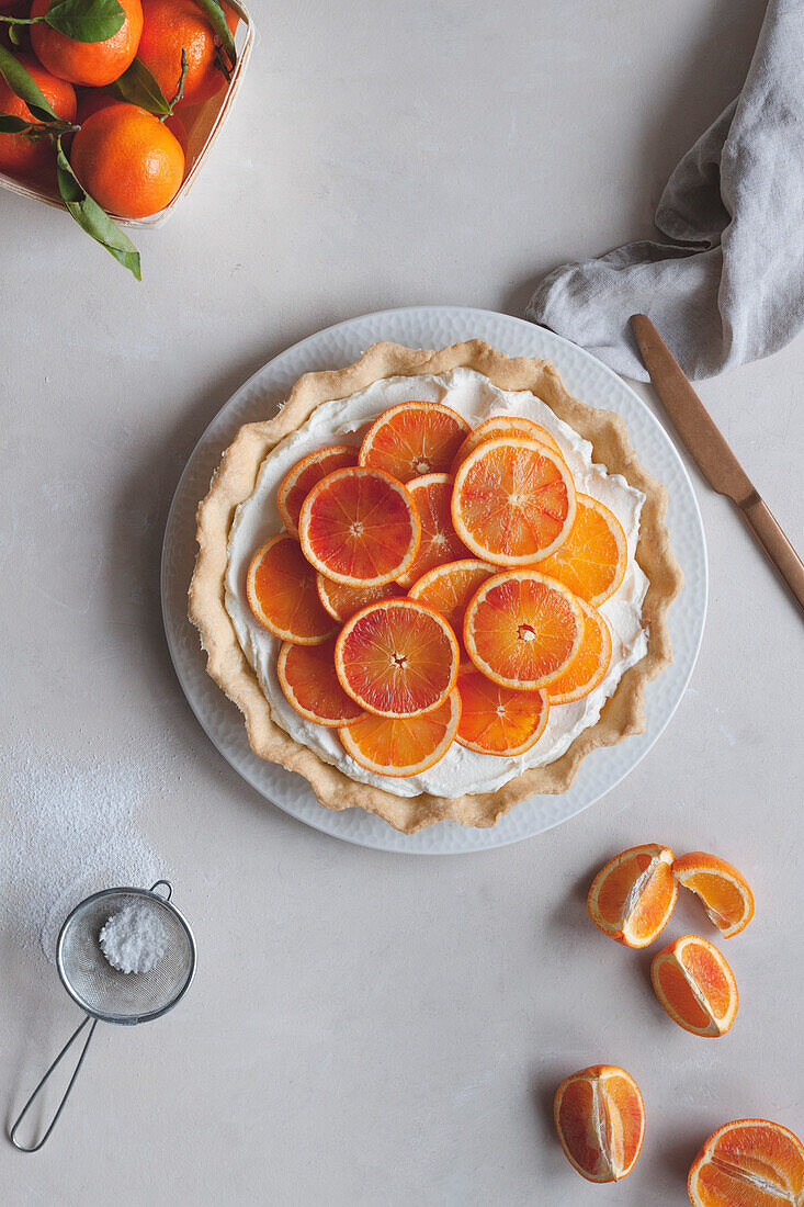 Tart with citrus fruit over a pastry base