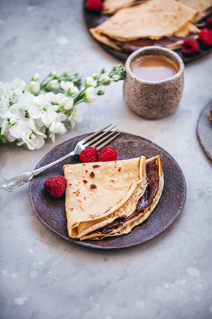 Crepe with chocolate spread served on a plate
