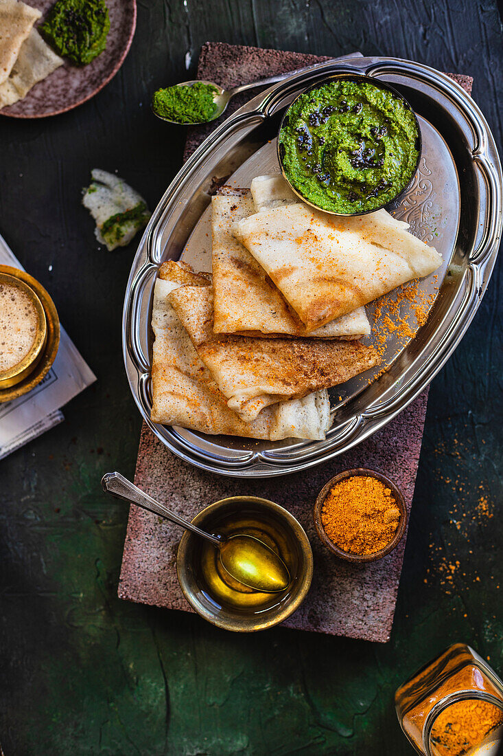 Dosa with Coriander chutney. Savory Indian Crepes.