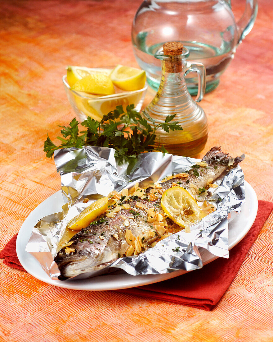 Trout with almonds baked in tin foil