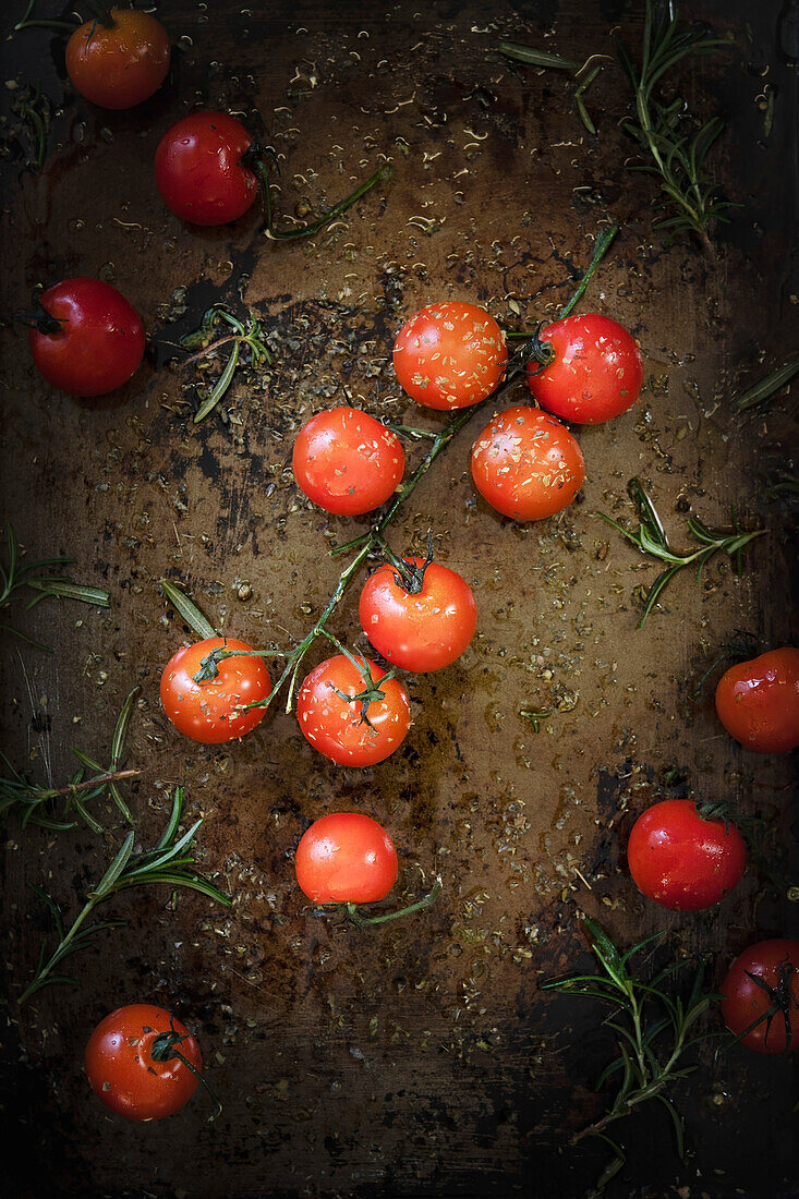 Cherry tomatoes prepared on a baking tray for roasting