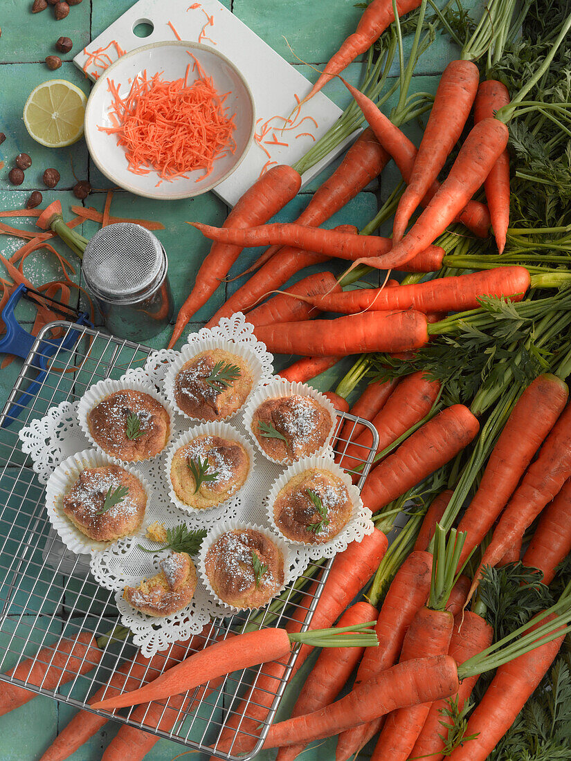 Carrots next to carrot muffins