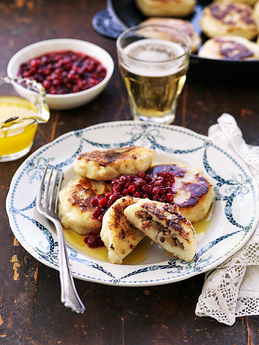 Potato dumpling with bacon and lingonberries