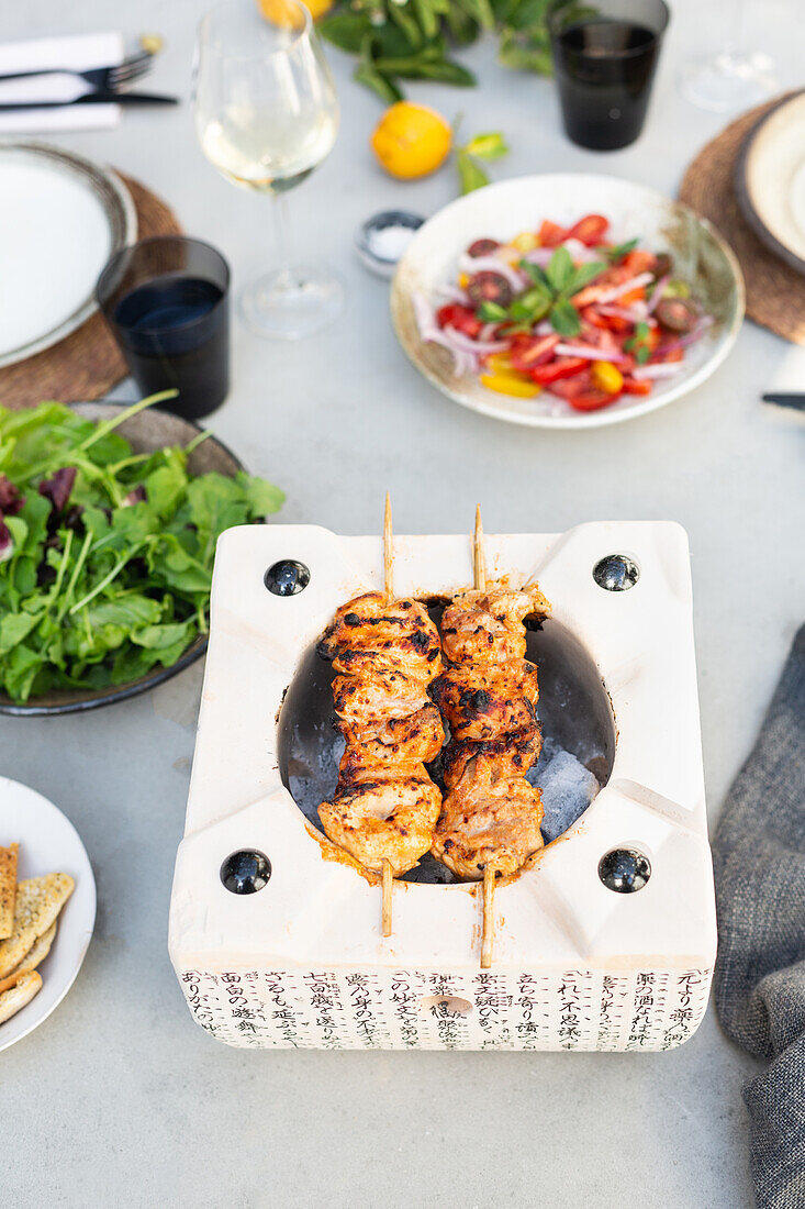 Chicken skewers on a hibachi grill