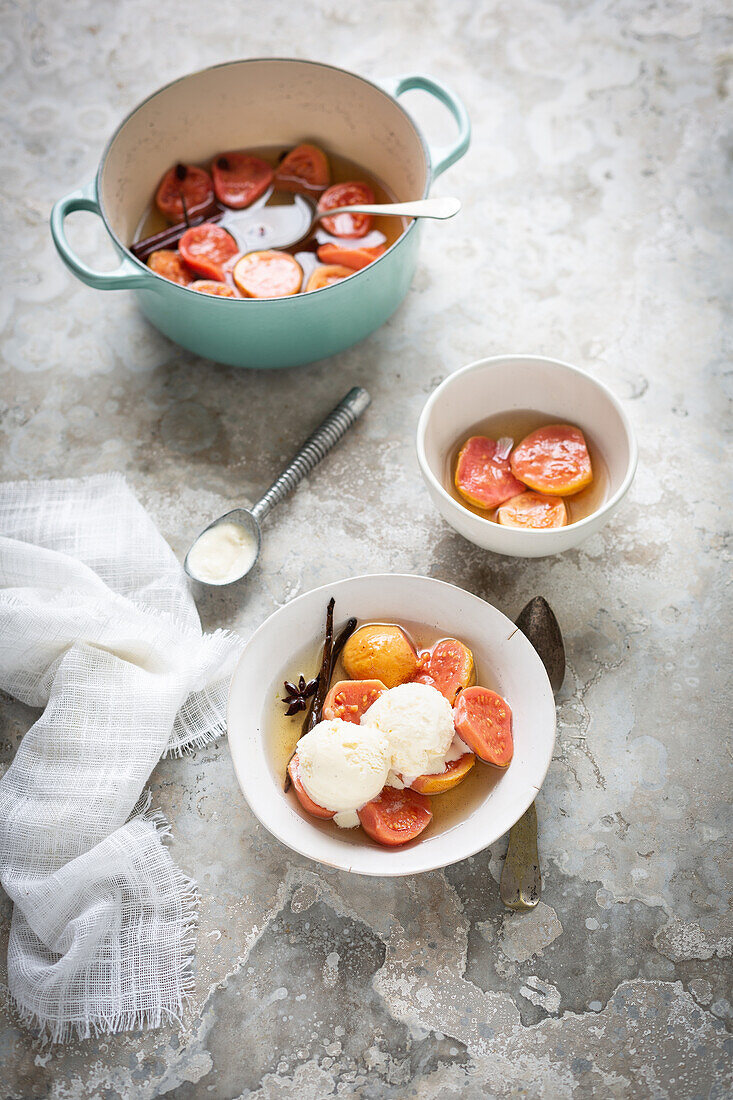 Poached guavas in syrup with ice cream