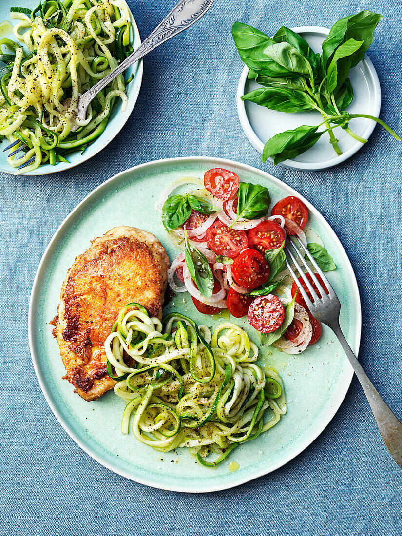 Chicken milanese with tomatoesalad and zucchini