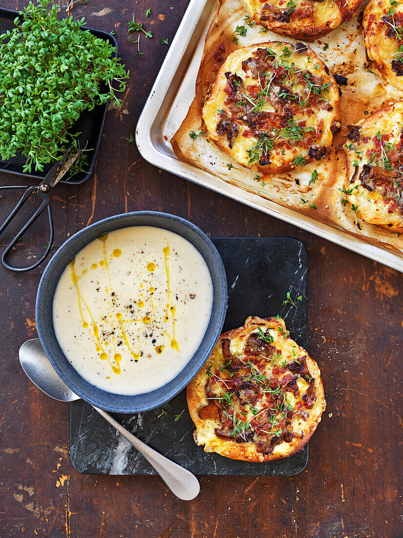 Pizza with mushrooms, cress and serrano ham. Soup with artichoke