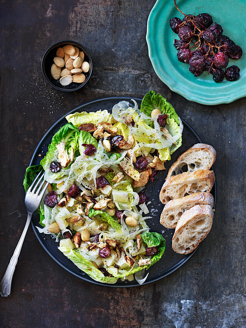Salad with fennel, cheese, almonds, grilled chicken and baked grapes