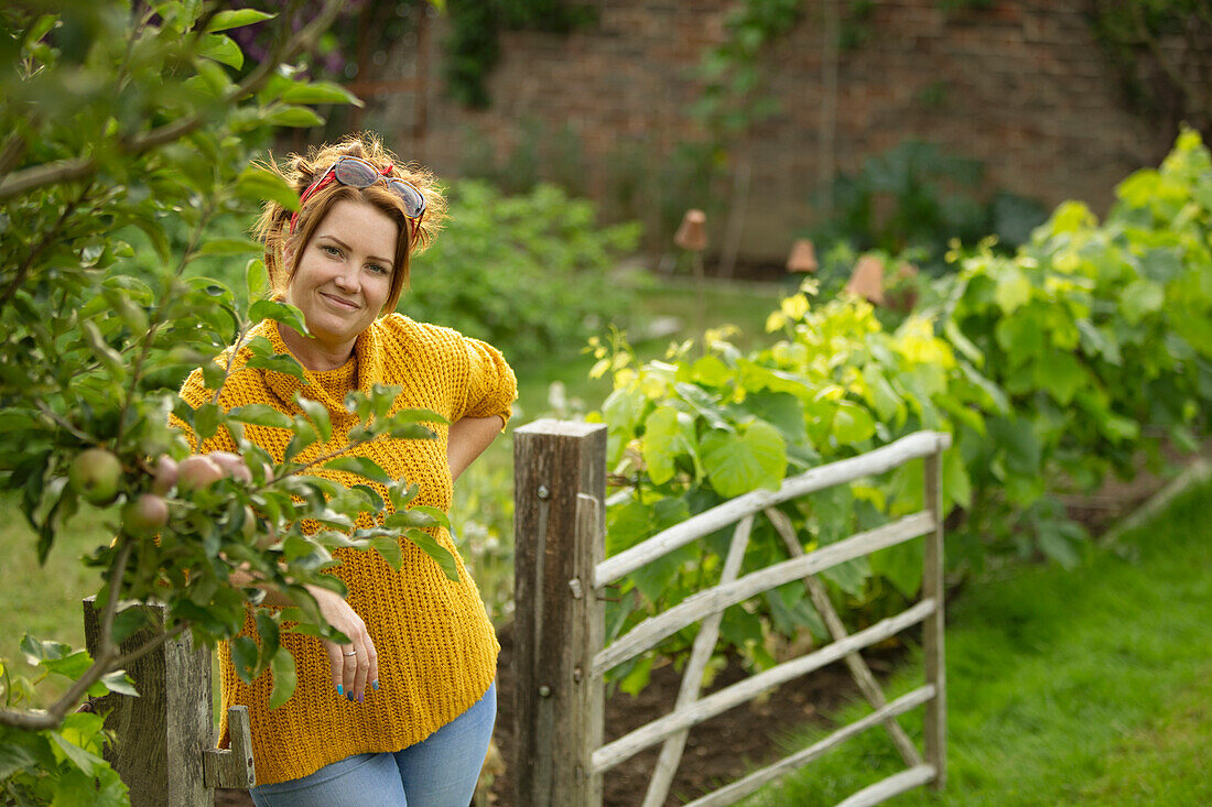 Happy woman in vegetable garden